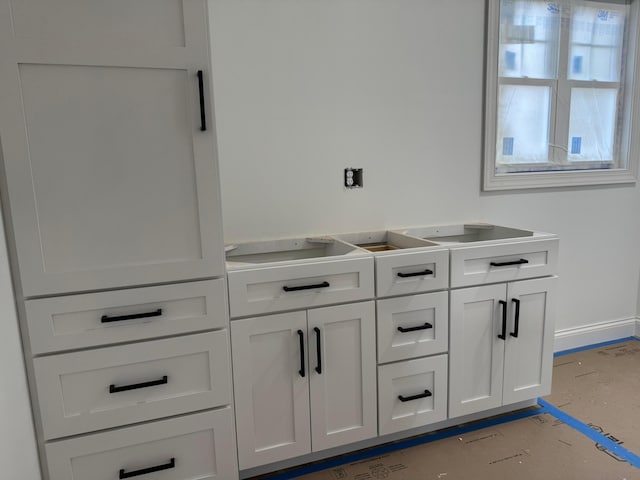 interior space featuring baseboards
