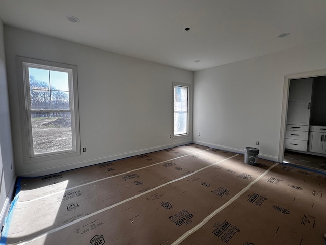 unfurnished bedroom featuring baseboards