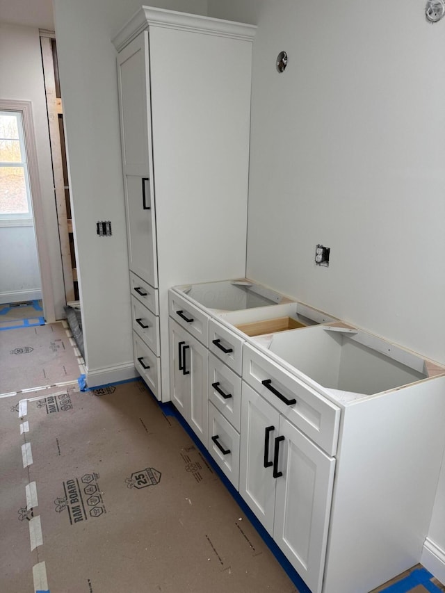 kitchen featuring light countertops and white cabinetry