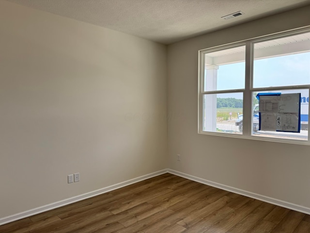 280 Dowler Dr Lot 349, South Bloomfield, OH 43103 - empty room with dark wood-style flooring and a textured ceiling
