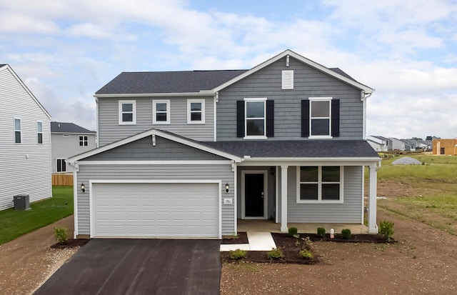 280 Dowler Dr Lot 349, South Bloomfield, OH 43103 - view of front facade featuring asphalt driveway, a porch, a garage, and roof with shingles