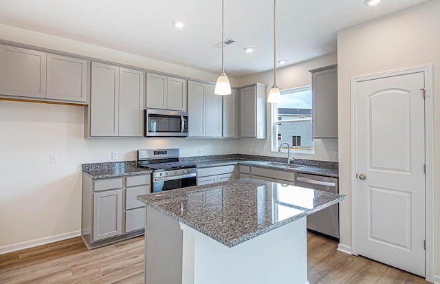 280 Dowler Dr Lot 349, South Bloomfield, OH 43103 - kitchen featuring stainless steel appliances, gray cabinets, dark stone countertops, light wood-type flooring, and recessed lighting