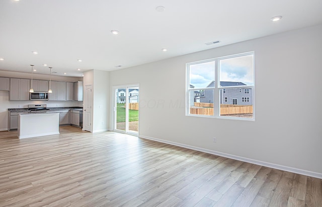 280 Dowler Dr Lot 349, South Bloomfield, OH 43103 - unfurnished living room with light wood-style floors and recessed lighting