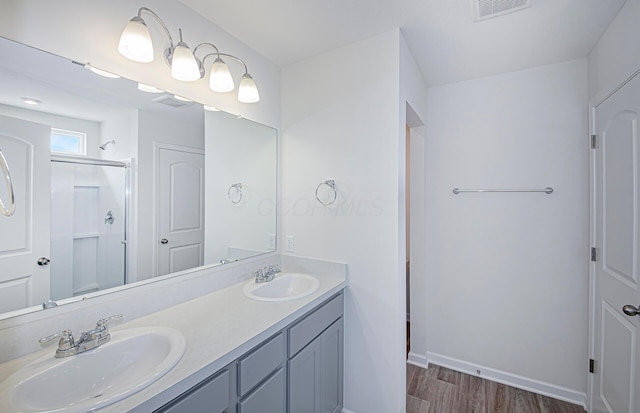 280 Dowler Dr Lot 349, South Bloomfield, OH 43103 - full bath featuring wood finished floors, double vanity, and a shower stall