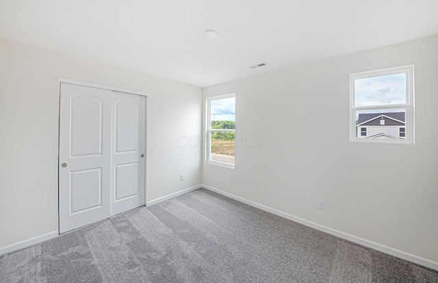 280 Dowler Dr Lot 349, South Bloomfield, OH 43103 - unfurnished bedroom featuring carpet floors and a closet
