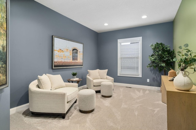 sitting room featuring recessed lighting, carpet flooring, and baseboards