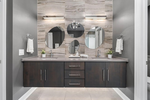 bathroom featuring double vanity, a sink, and decorative backsplash