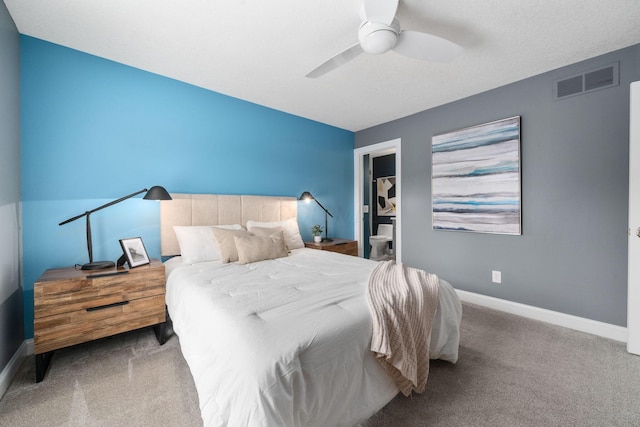 carpeted bedroom featuring visible vents, baseboards, and ceiling fan