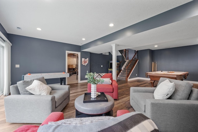 living area with billiards, stairs, wood finished floors, and baseboards