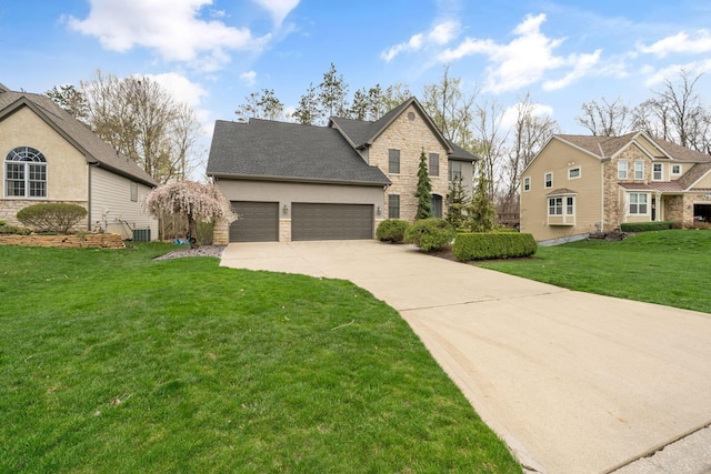 traditional-style house with stucco siding, stone siding, a front lawn, an attached garage, and concrete driveway