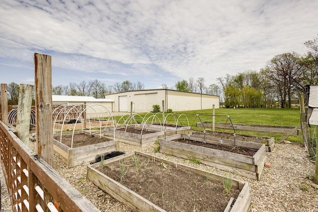 view of yard with an outdoor structure and a garden