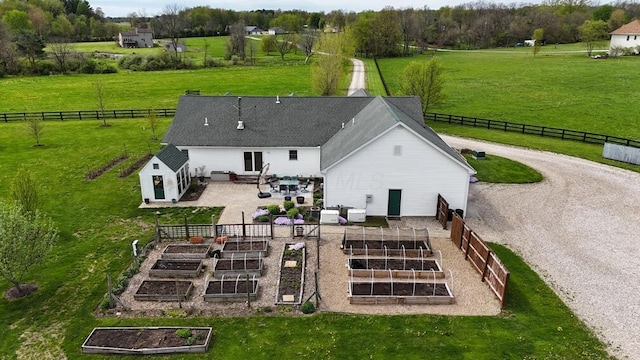 birds eye view of property featuring a rural view