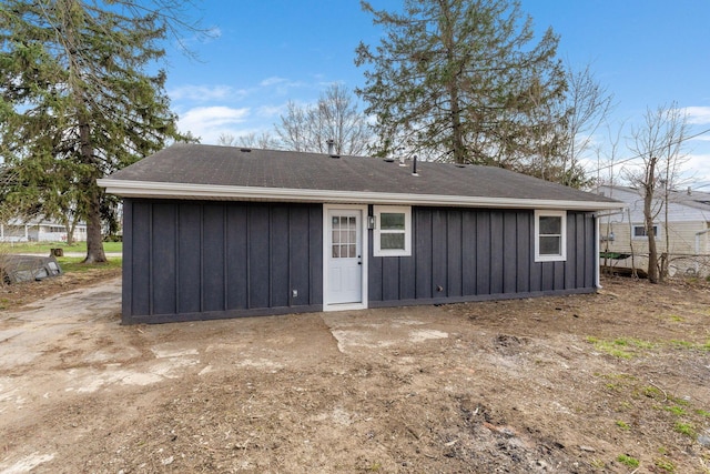 back of property featuring board and batten siding