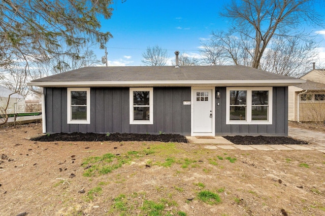 ranch-style home featuring board and batten siding