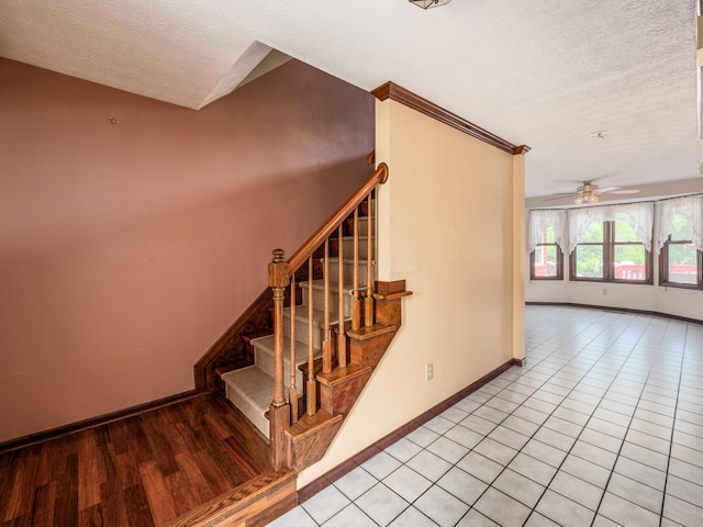 162 Juniper Ave, Westerville, OH 43081 - staircase with a textured ceiling, ceiling fan, and wood finished floors