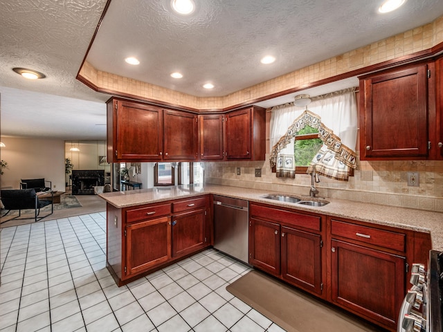 162 Juniper Ave, Westerville, OH 43081 - kitchen featuring dishwasher, a textured ceiling, open floor plan, a peninsula, and decorative backsplash