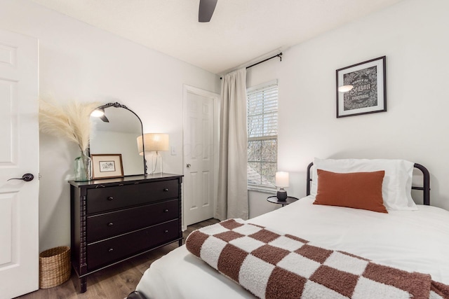 bedroom with a ceiling fan and wood finished floors