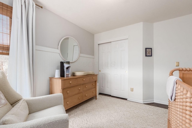 living area featuring a wainscoted wall