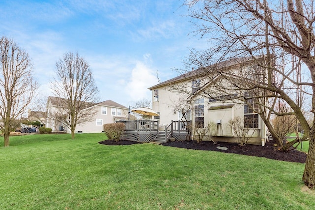 view of yard featuring a wooden deck