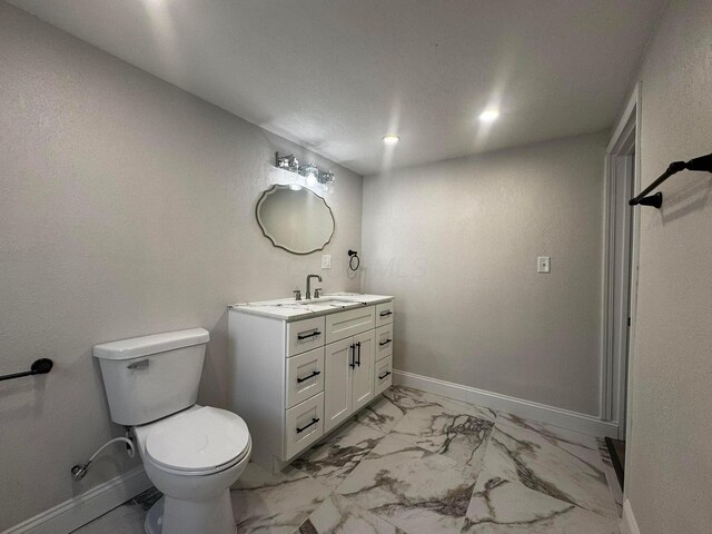 9808 Alderman Rd, Millfield, OH 45761 - bathroom featuring vanity, recessed lighting, toilet, baseboards, and marble finish floor