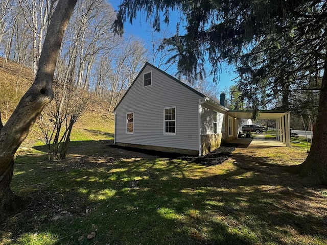 9808 Alderman Rd, Millfield, OH 45761 - view of property exterior with a carport and a yard