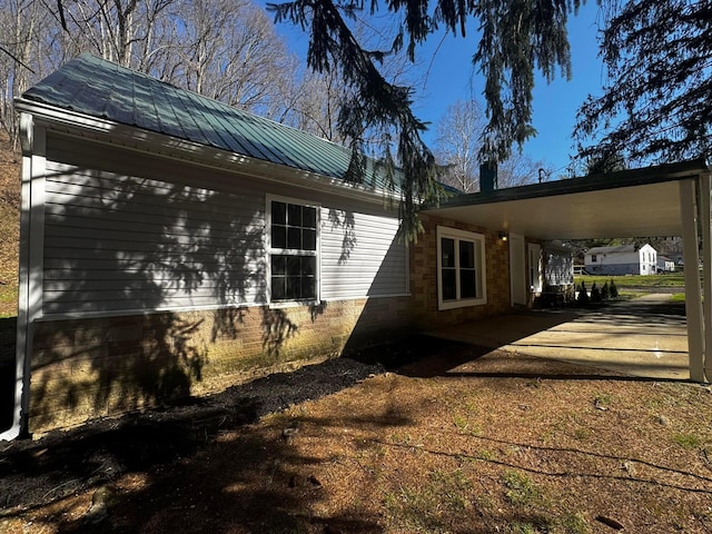 9808 Alderman Rd, Millfield, OH 45761 - view of side of home with metal roof and a carport