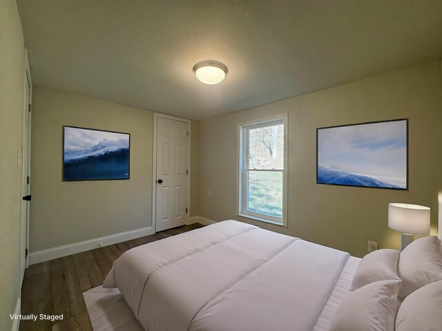 9808 Alderman Rd, Millfield, OH 45761 - bedroom featuring baseboards and wood finished floors