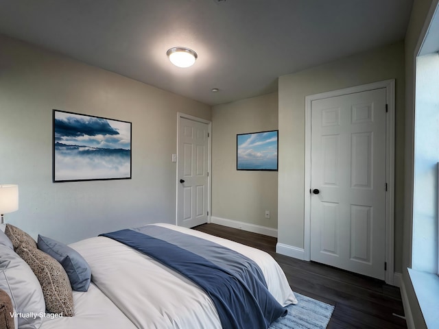 9808 Alderman Rd, Millfield, OH 45761 - bedroom featuring baseboards and dark wood finished floors