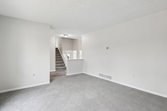 601 Congress Ct, Delaware, OH 43015 - empty room with carpet flooring, baseboards, and stairway