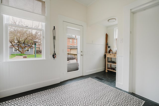 doorway to outside with wainscoting
