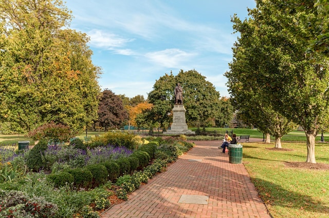 surrounding community with a yard