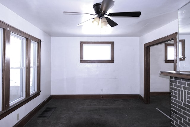 1256 S Champion Ave, Columbus, OH 43206 - spare room featuring carpet floors, baseboards, and a ceiling fan