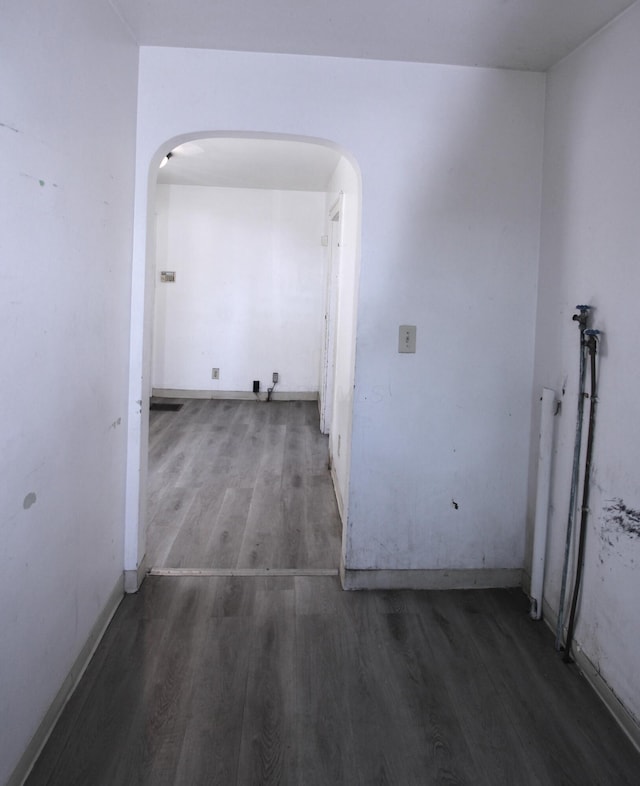 1256 S Champion Ave, Columbus, OH 43206 - hall with arched walkways, wood finished floors, and baseboards