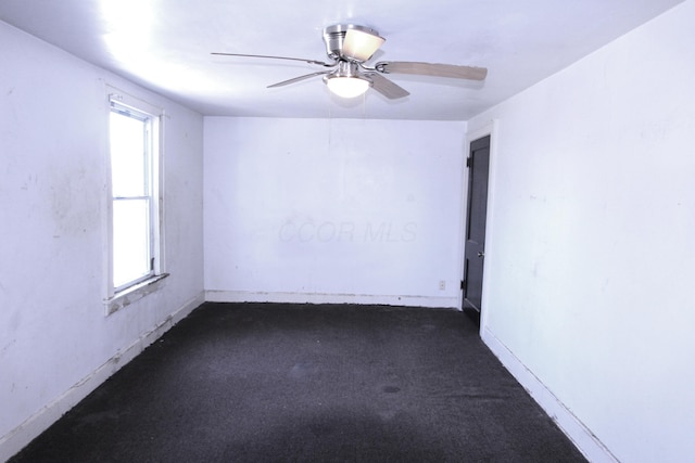 1256 S Champion Ave, Columbus, OH 43206 - unfurnished room with plenty of natural light, dark colored carpet, ceiling fan, and baseboards