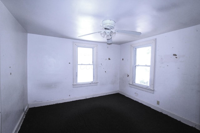 1256 S Champion Ave, Columbus, OH 43206 - spare room featuring baseboards, ceiling fan, and plenty of natural light