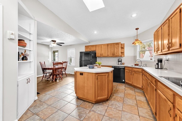 kitchen with light countertops, a kitchen island, open shelves, tasteful backsplash, and black appliances