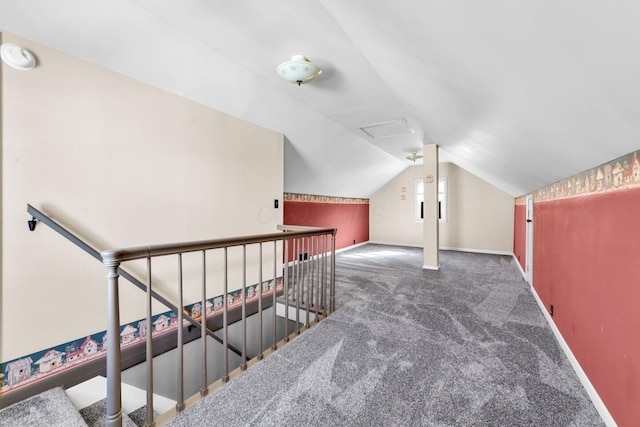 additional living space with carpet, lofted ceiling, and baseboards