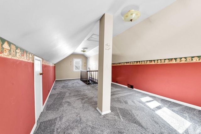 bonus room featuring carpet floors, baseboards, and lofted ceiling