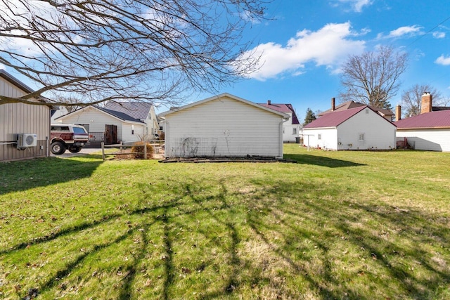 view of yard featuring a residential view, ac unit, and fence