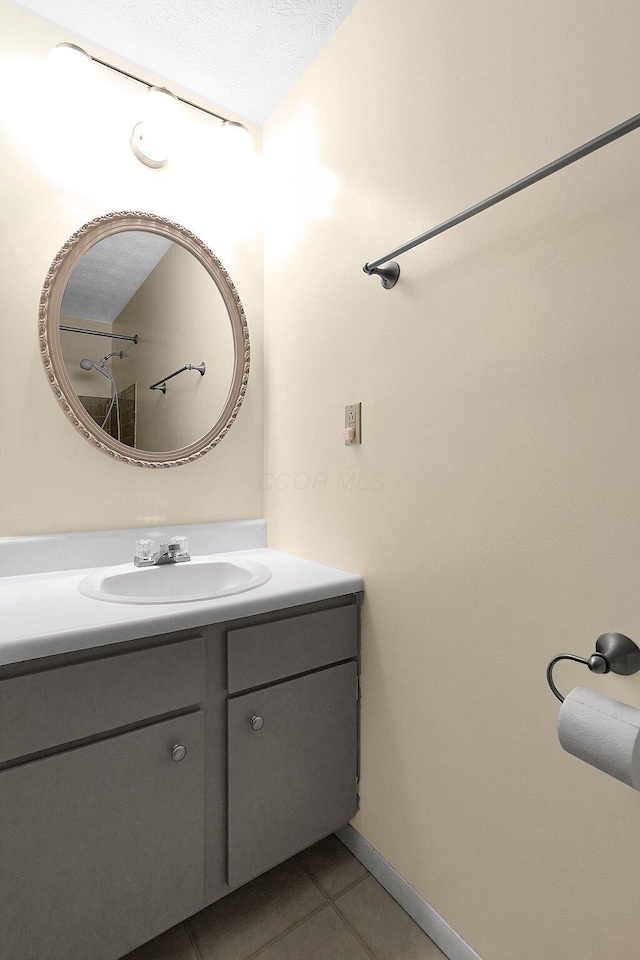 572 Sycamore Dr, Pickerington, OH 43147 - bathroom with vanity, tile patterned flooring, and baseboards