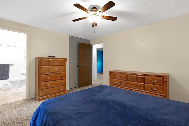572 Sycamore Dr, Pickerington, OH 43147 - bedroom with light colored carpet, ensuite bath, and a ceiling fan