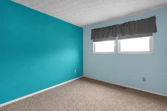 572 Sycamore Dr, Pickerington, OH 43147 - spare room with a textured ceiling, carpet flooring, and baseboards
