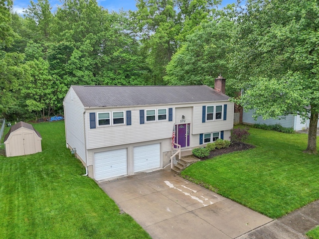 572 Sycamore Dr, Pickerington, OH 43147 - bi-level home featuring driveway, a chimney, a front yard, and an attached garage