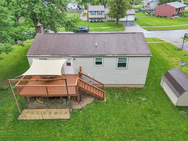 572 Sycamore Dr, Pickerington, OH 43147 - rear view of house featuring a wooden deck, a chimney, a yard, and roof with shingles