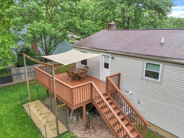 572 Sycamore Dr, Pickerington, OH 43147 - back of property with a shingled roof, a deck, outdoor dining area, and a chimney