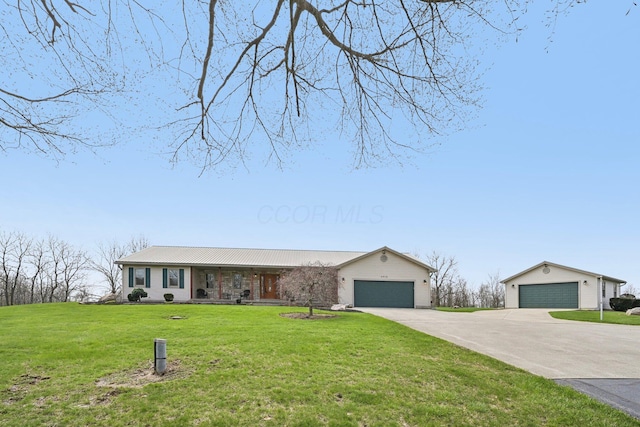 ranch-style house featuring concrete driveway, a front yard, and an attached garage