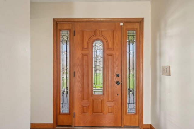 entrance foyer featuring baseboards