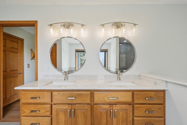 full bath featuring double vanity and a sink