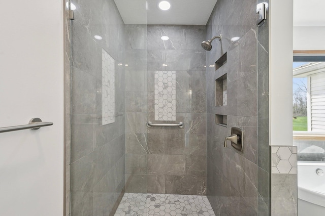 full bathroom with a tile shower