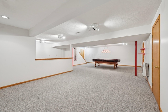 game room with a textured ceiling, light carpet, baseboards, billiards, and heating unit